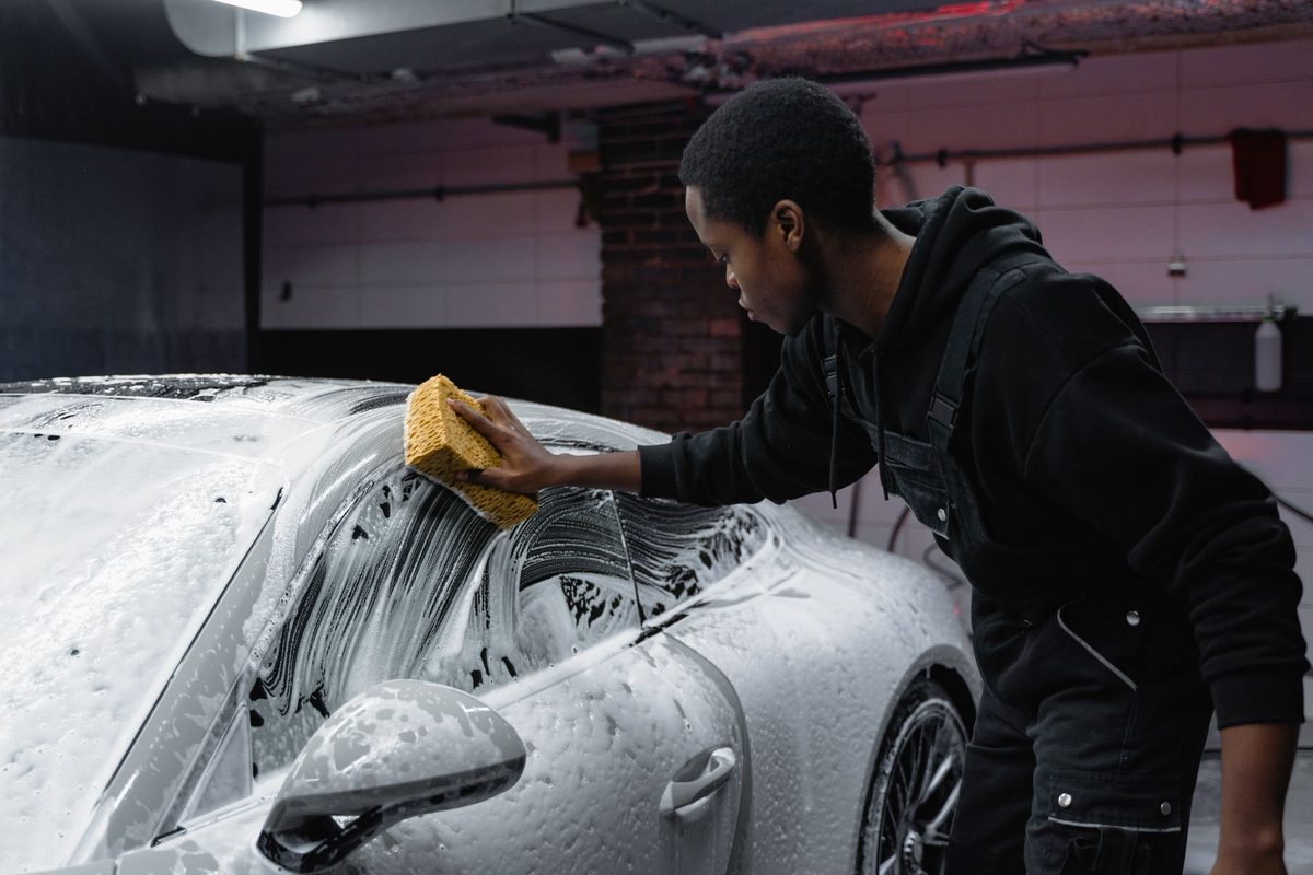 Thick white foam covering a car during the pre-wash